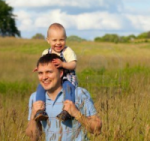 15357841-father-and-child-on-summer-field